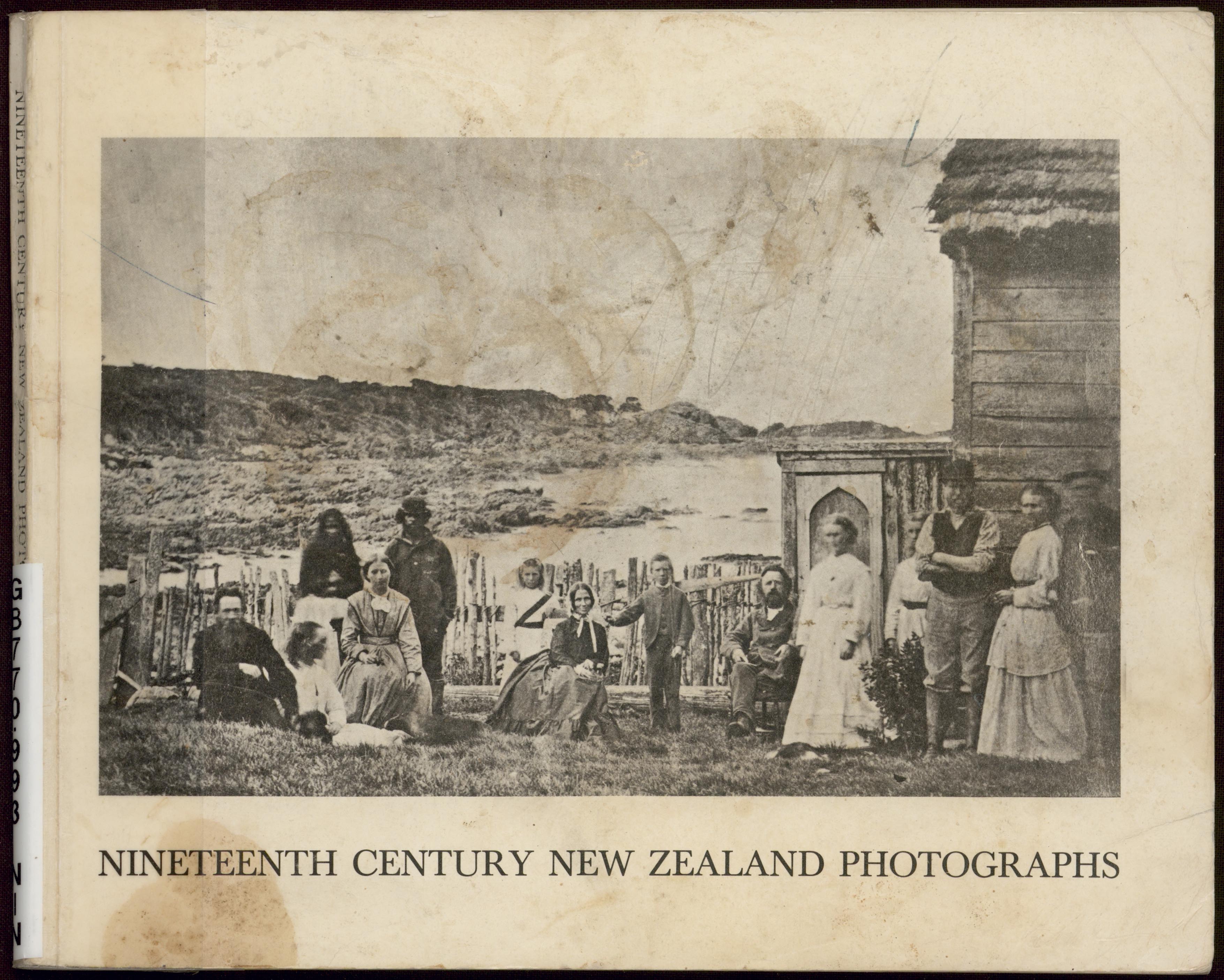 Catalogue cover image, showing a black and white historical photograph of a group of people gathered next to a wooden building, with a coastal landscape in the background. Catalogue cover image, showing a black and white historical photograph of a group of people gathered next to a wooden building, with a coastal landscape in the background.